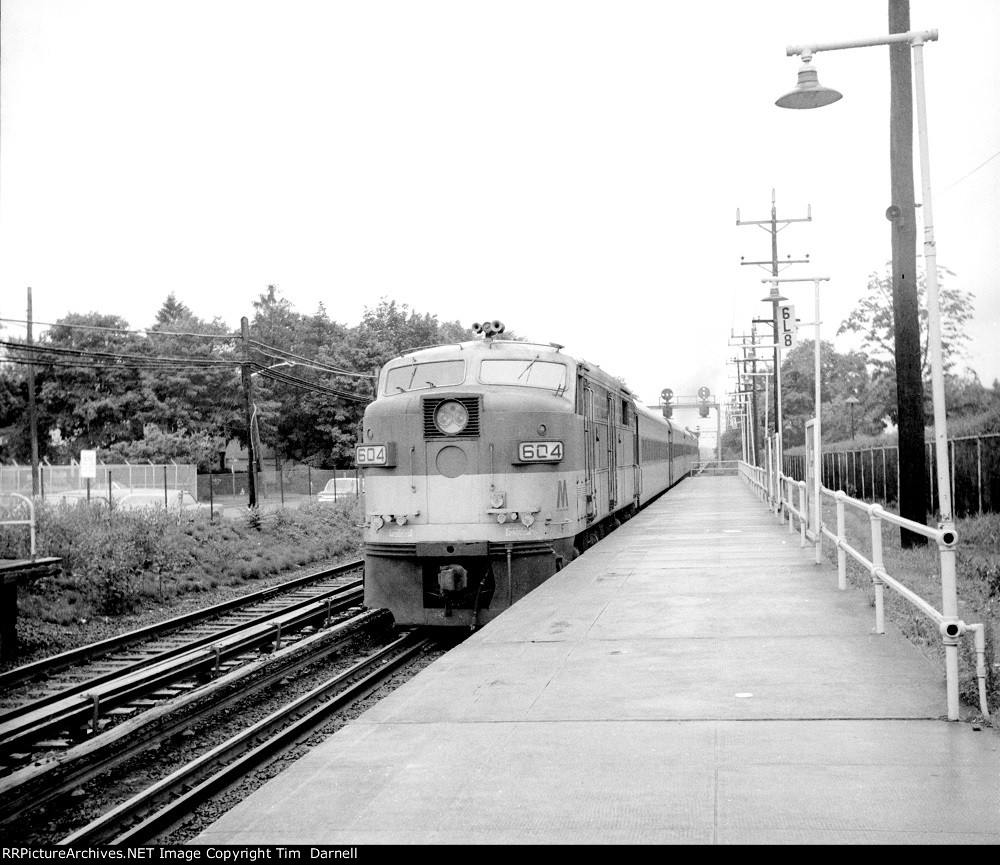 LI 604 heads west on the east end of the train.